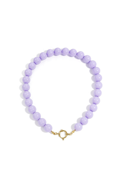 Chunky deep pink resin beaded necklace with gold clasp on white background