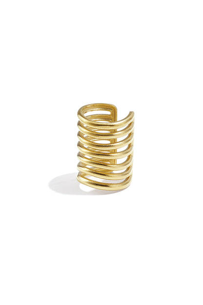 Close-up of a layered gold-tone stainless steel ear cuff with multiple bars.