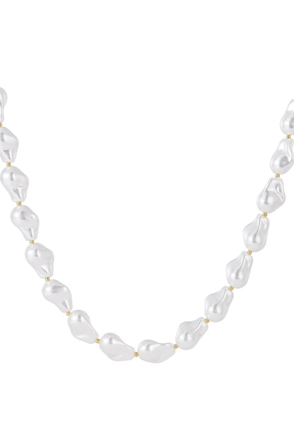 Baroque imitation pearl necklace with white irregular shaped pearls and tiny gold beads, displayed on a white background