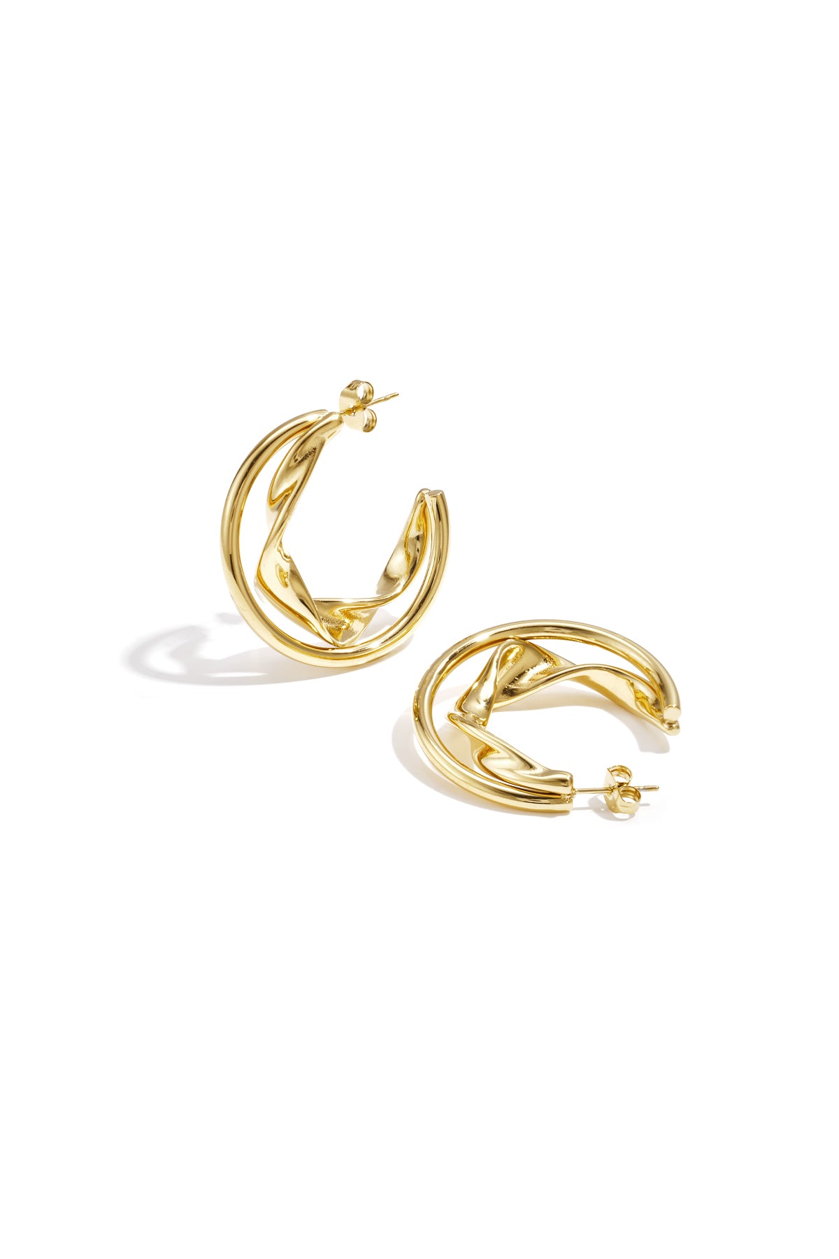 Gold twisted double hoop earrings displayed on white background