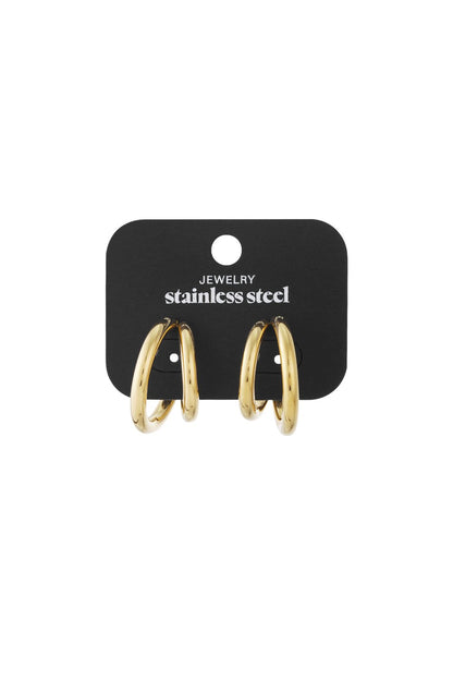 Y2K Glazed Disco Hoops: A pair of thick, polished gold-tone stainless steel hoop earrings on a black display card.
