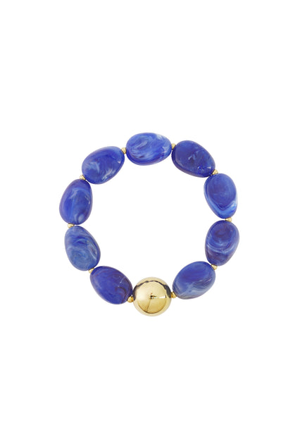 Blue marbled acrylic beaded bracelet with central polished gold-tone bead on white background