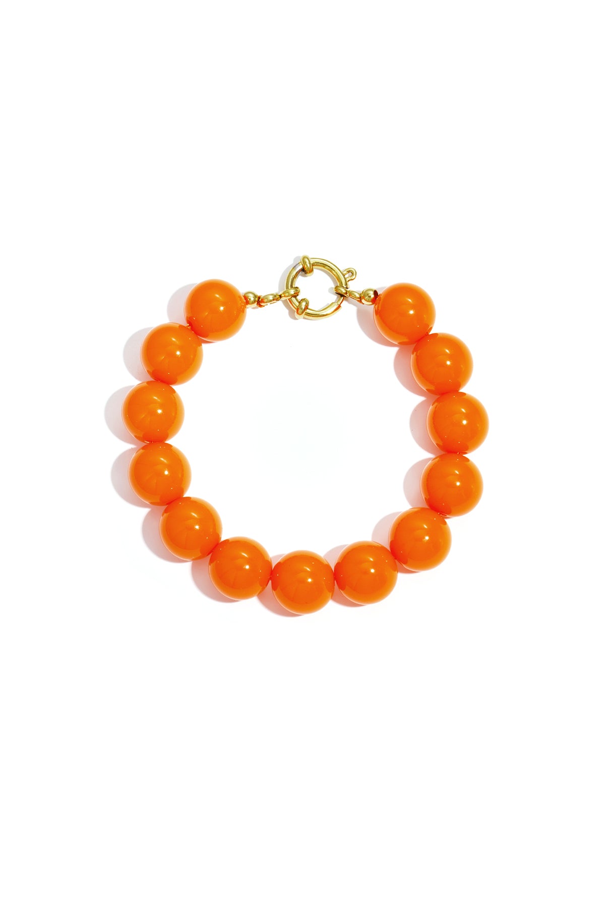 Orange chunky beaded bracelet with glossy resin beads and gold front closure clasp