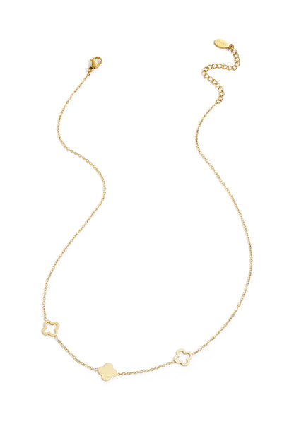 Gold-tone delicate necklace with three clover charms laid flat on white background