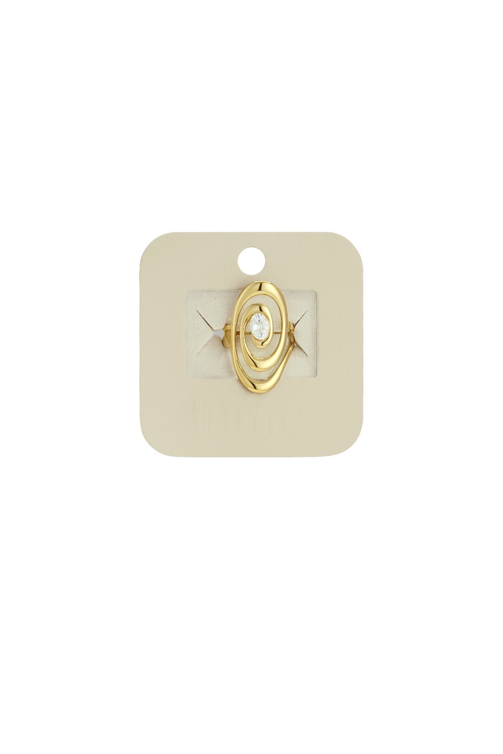 Gold ring with a modern oval-shaped swirl design featuring a central clear gemstone, displayed on a beige card.