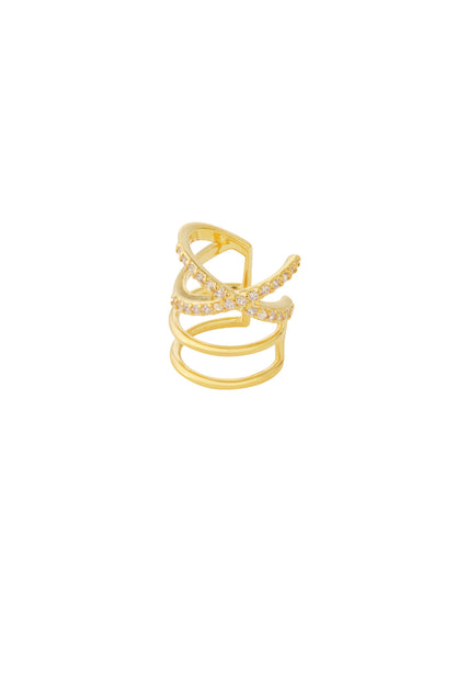 Close-up of a gold-tone crystal-encrusted crisscross ear cuff on white background