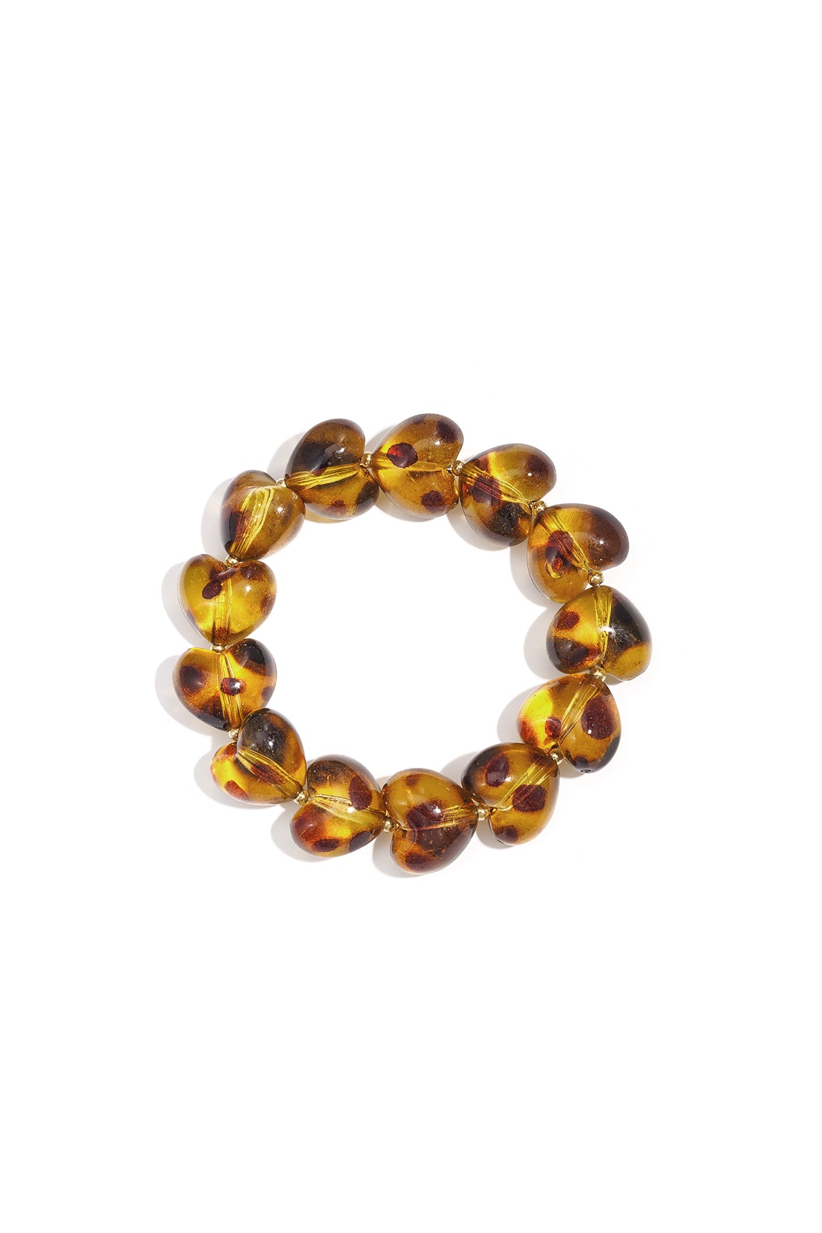 Close-up of a leopard print heart-shaped acrylic beaded bracelet in amber tones on white background