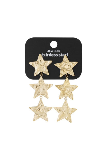 Gold-toned stainless steel drop earrings featuring three graduated, hammered-texture star charms in a vertical row.