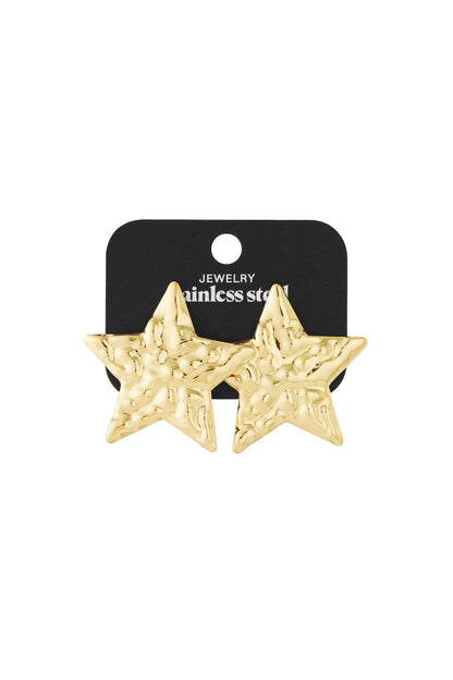 Cosmic Glitch gold-tone star stud earrings with a textured, hammered finish on a black stainless steel display card.
