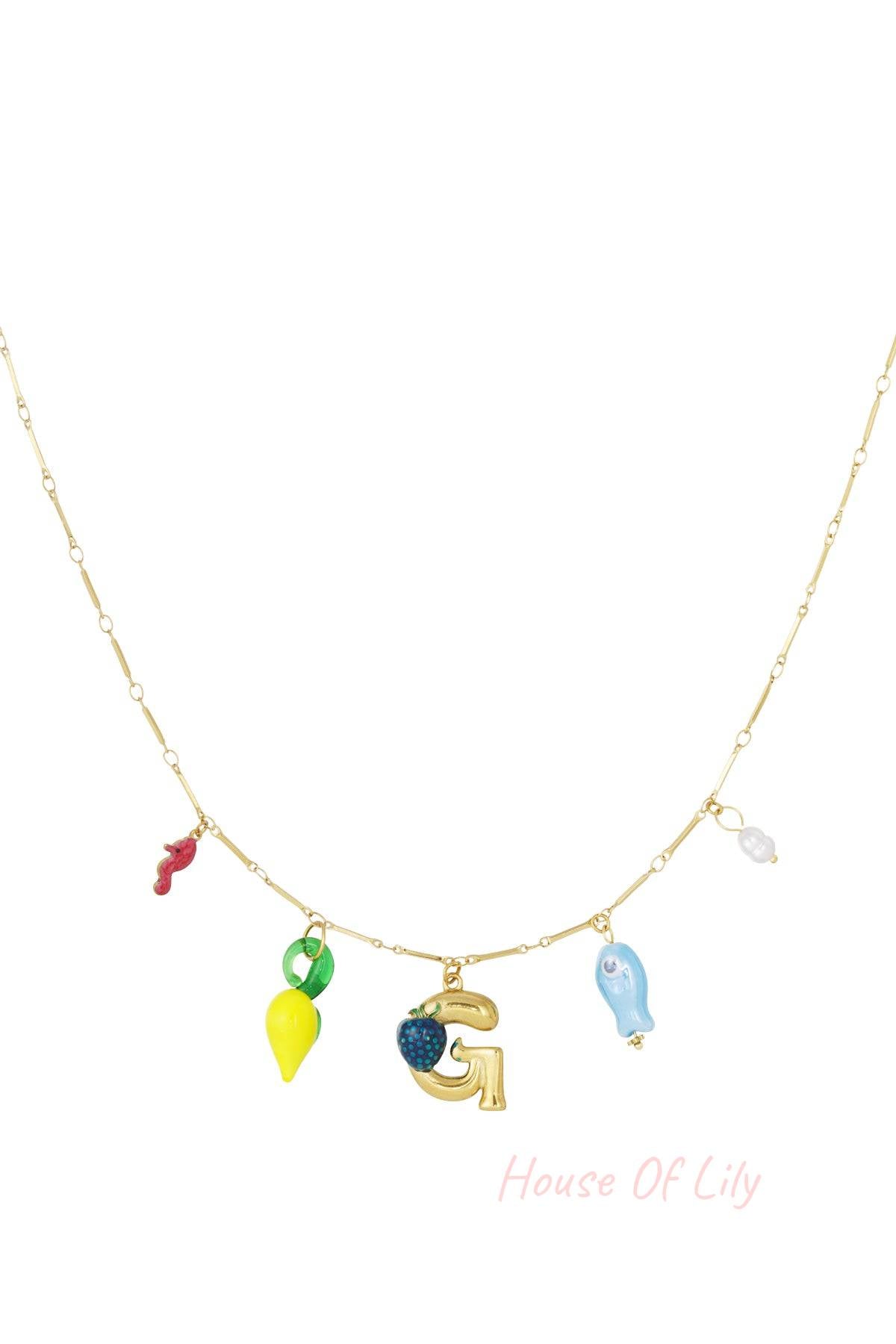 Gold charm necklace with gold starfish, orange coral, gold letter L with turtle charm, white seashell, and orange fish charms