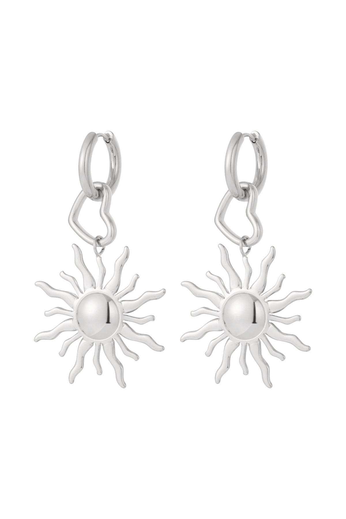 Pair of silver tone drop earrings featuring sun-shaped pendants and heart-shaped links attached to small silver hoops