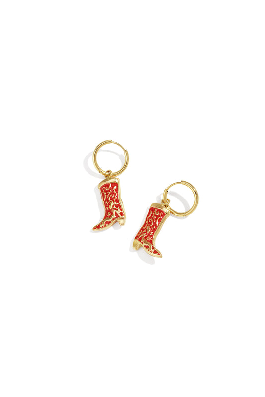 Pair of gold-tone drop earrings with red enamel cowboy boot charms on white background