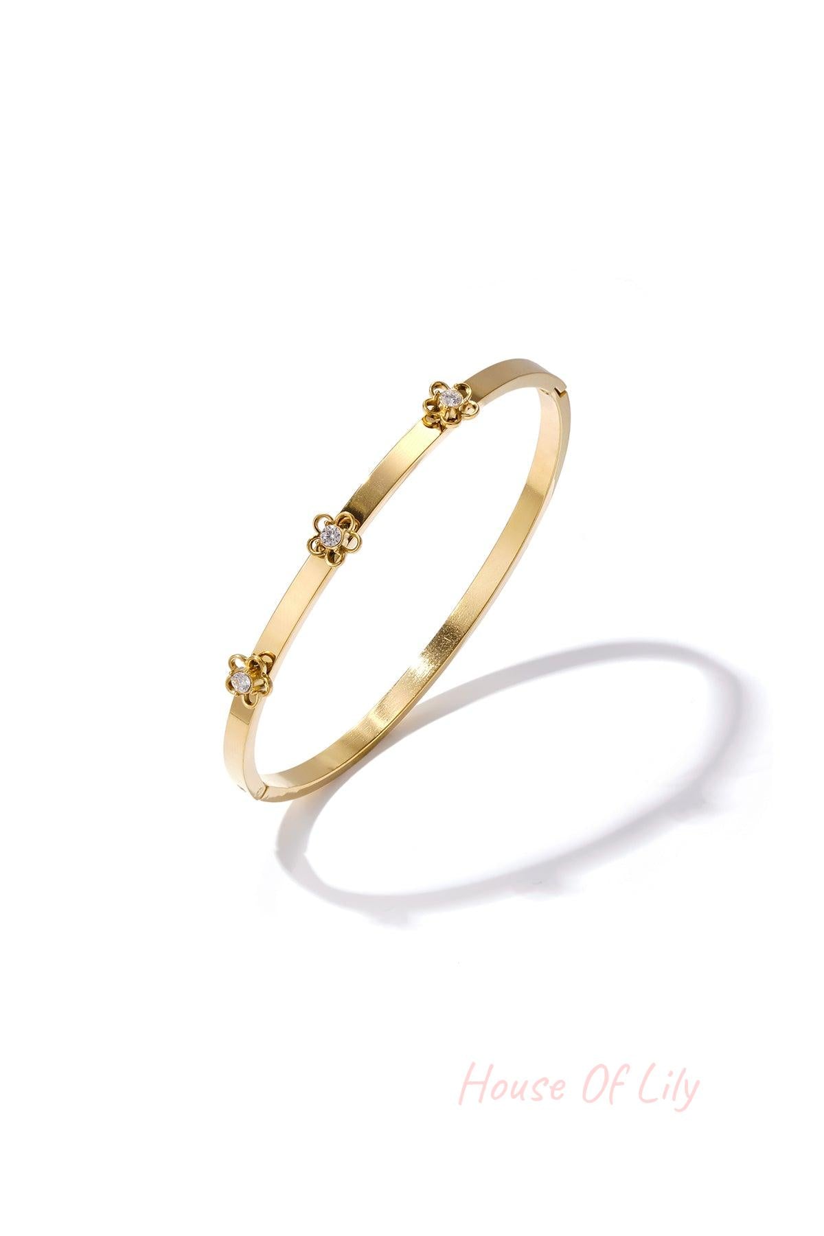 Bangle with floral detail and rhinestone
