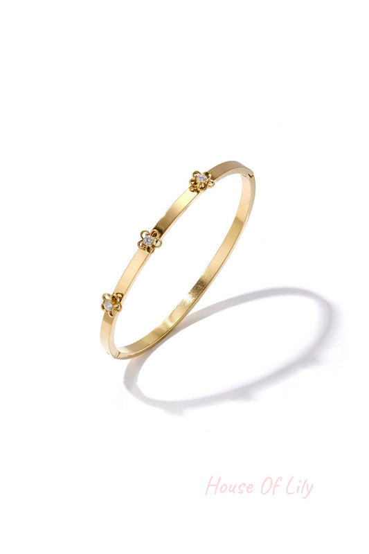 Bangle with floral detail and rhinestone