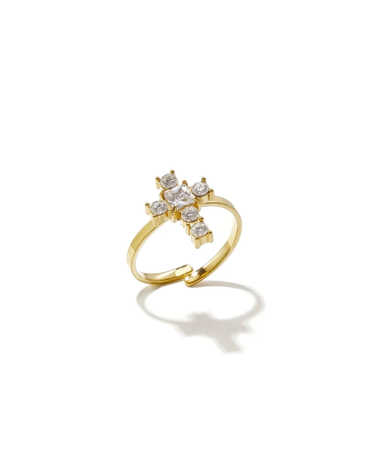 Gold-colored ring featuring a cross-shaped centerpiece set with clear crystal stones.