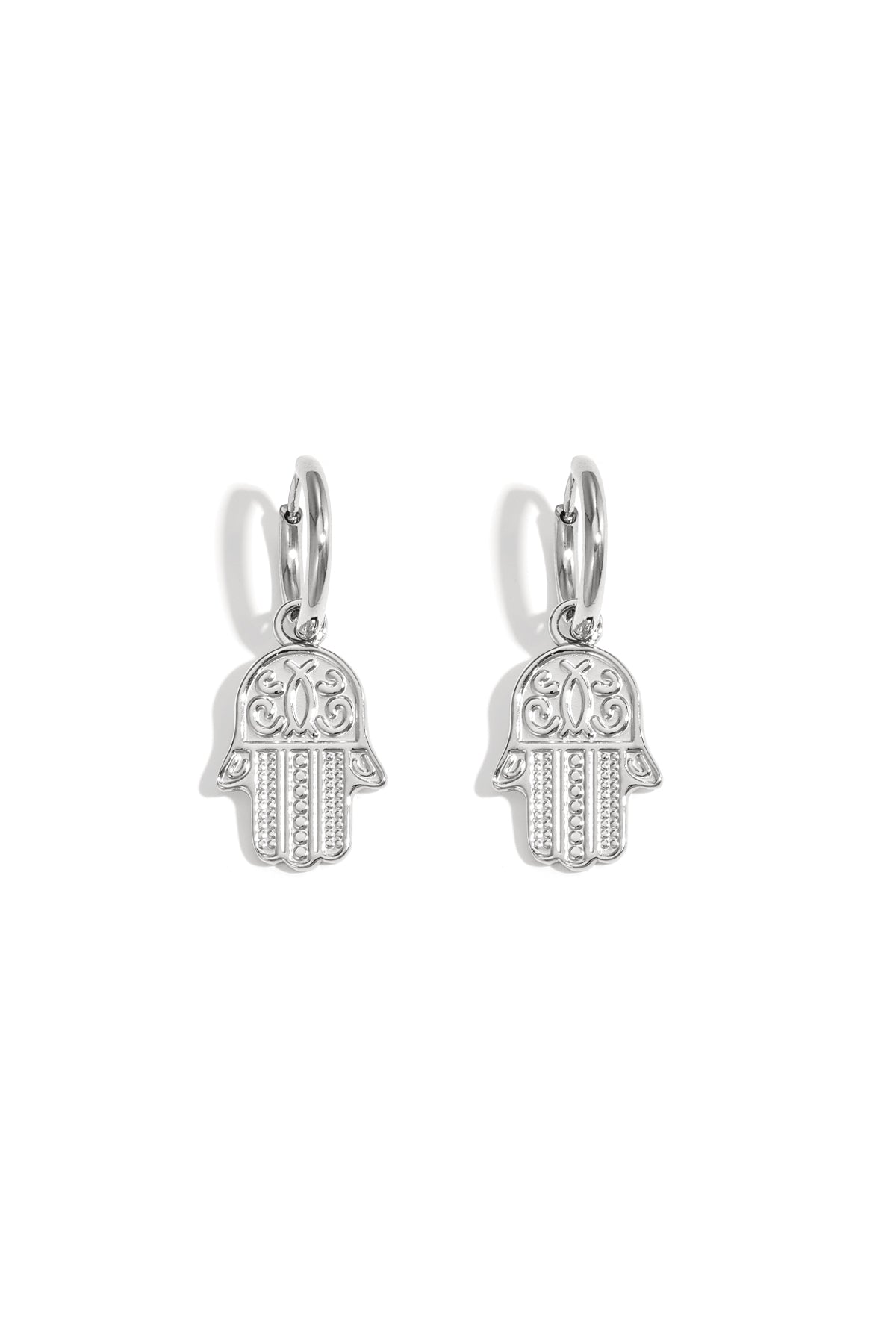 Pair of silver tone Hamsa charm drop earrings on white background