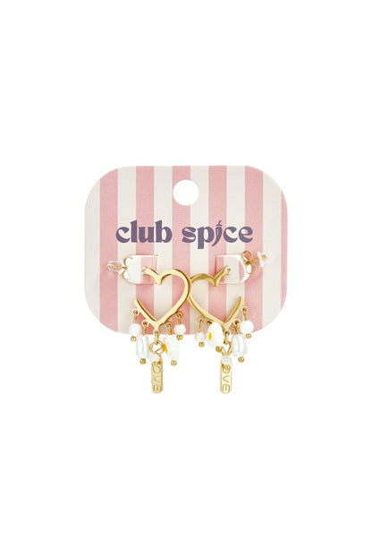 Gold heart-shaped drop earrings with white pearls and small "LOVE" charms on a pink and white striped display card.