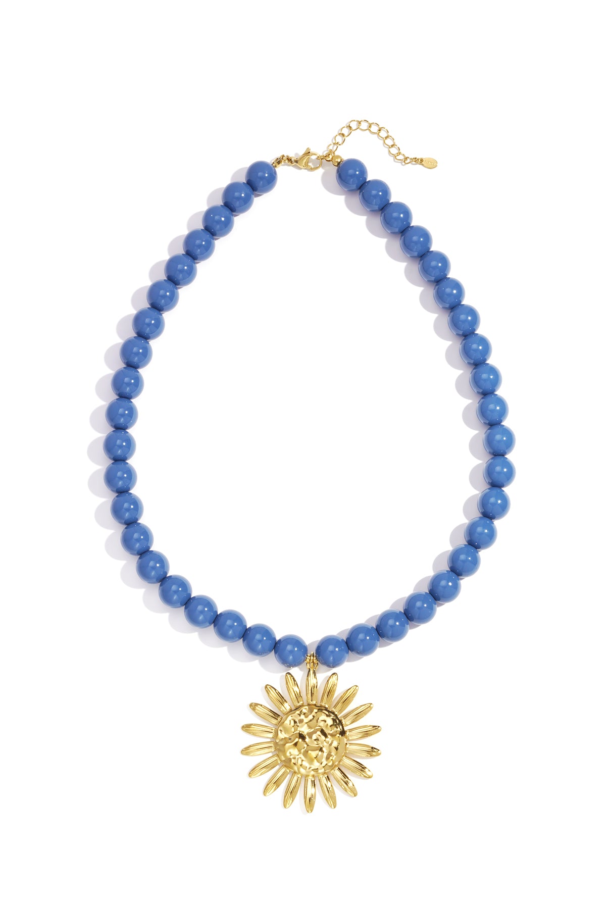Blue beaded necklace with gold sun pendant laid flat showing clasp and pendant details