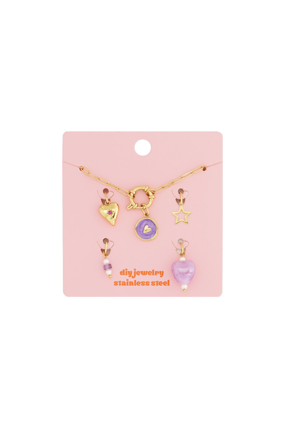 Gold-tone stainless steel modular charm bracelet kit with heart, star, and purple enamel charms on a pink display card.