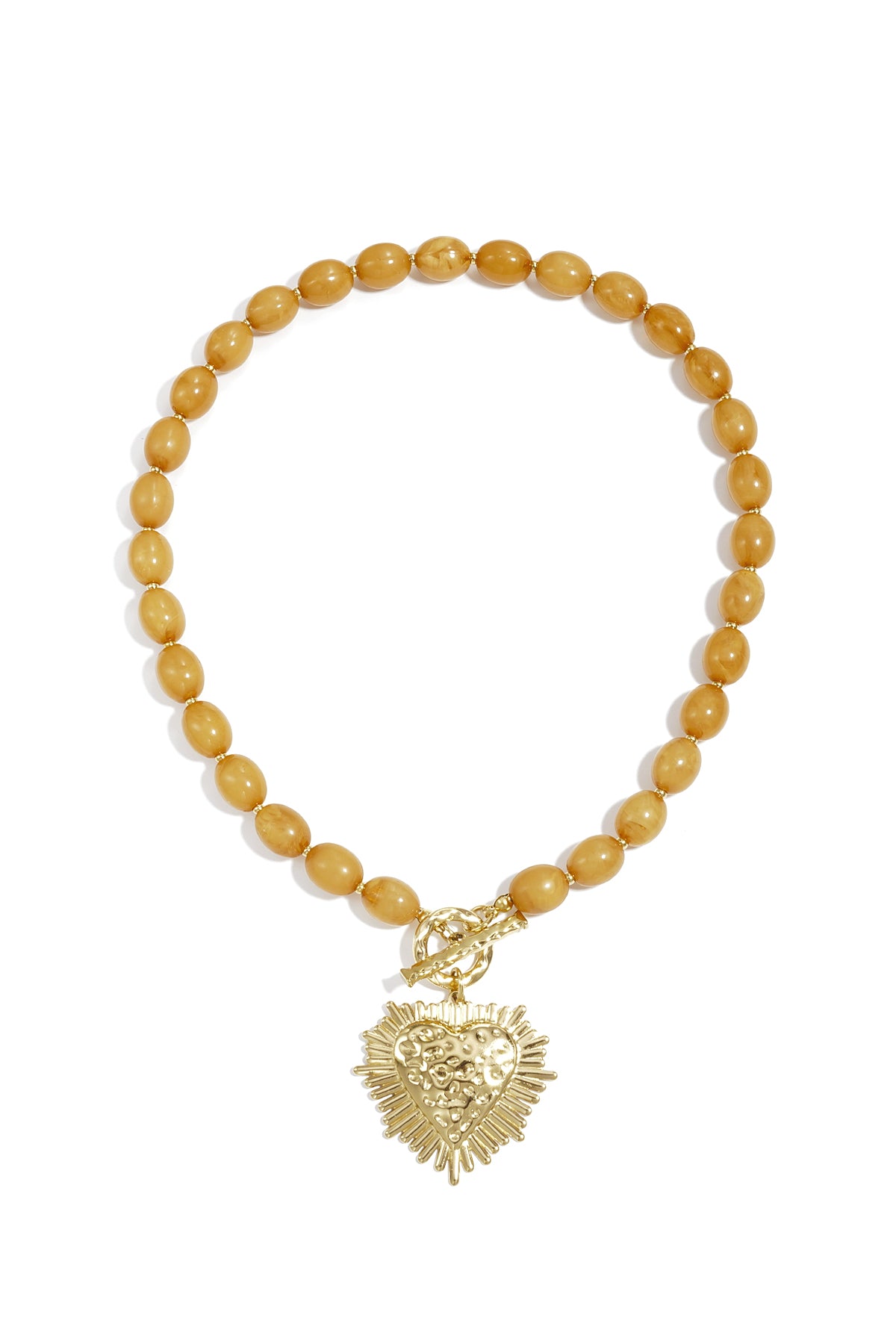 studio shot of baby blue beaded necklace with gold textured heart pendant and toggle clasp