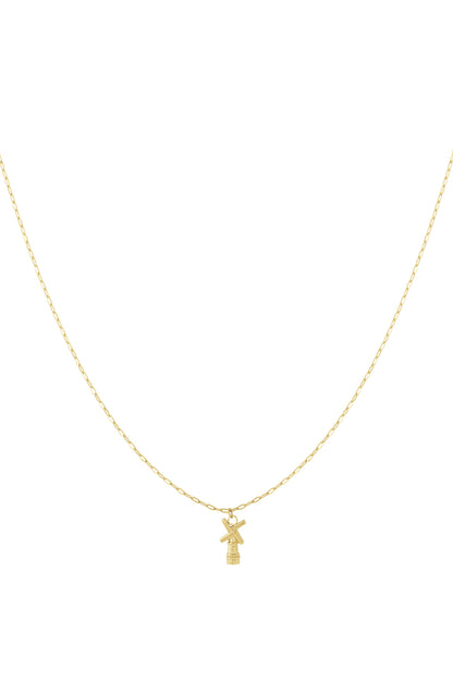 Gold chain necklace with a small windmill pendant displayed on white background