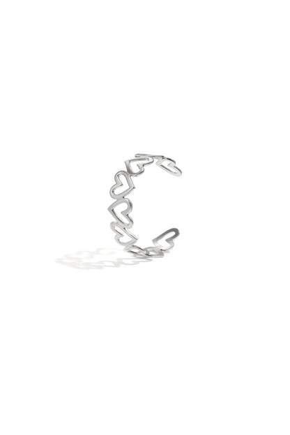 Silver-tone open cuff bracelet with linked hollow heart shapes displayed on white background