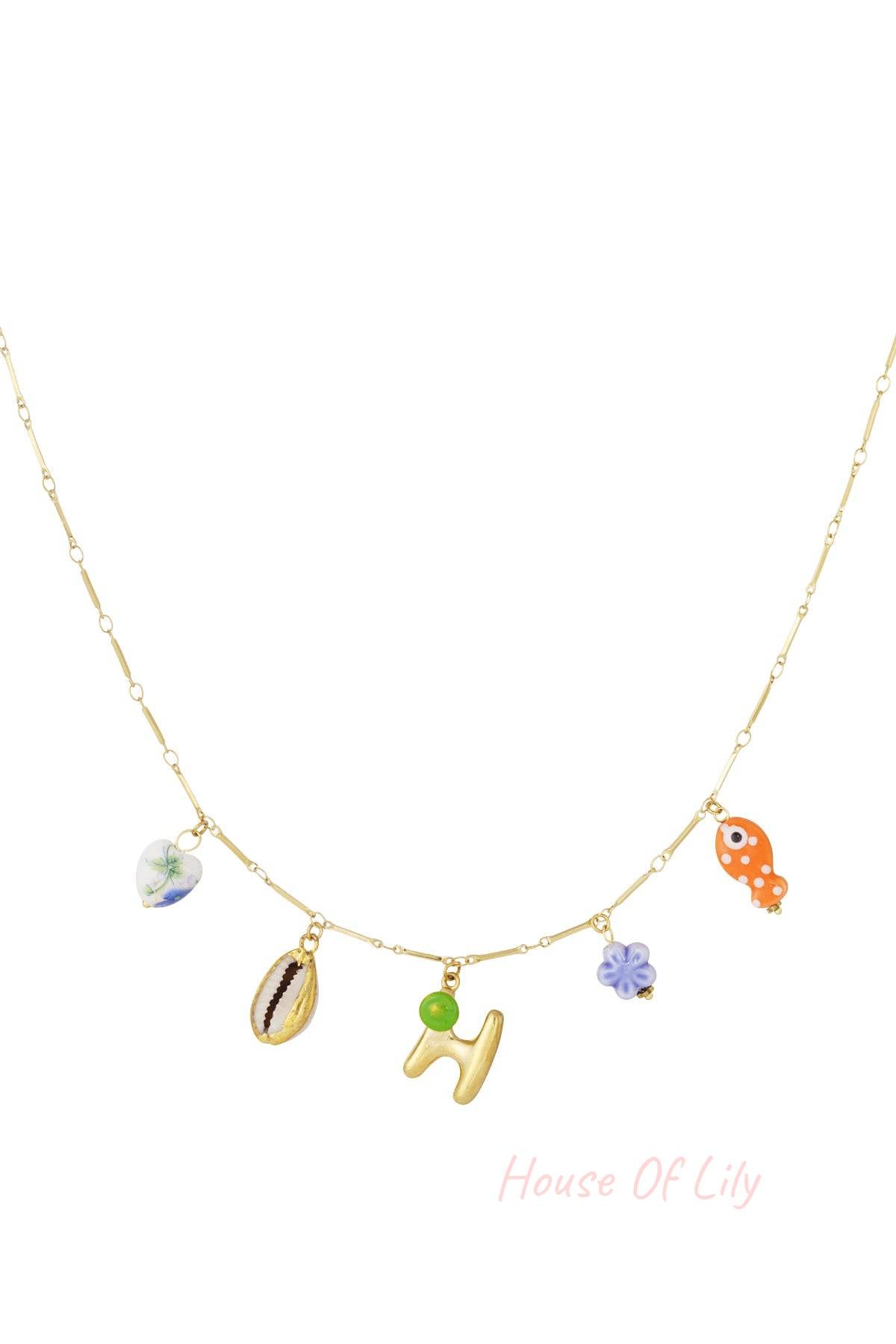Main Character Initial gold chain necklace with colorful charms: heart, shell, initial H, purple flower, and orange fish.
