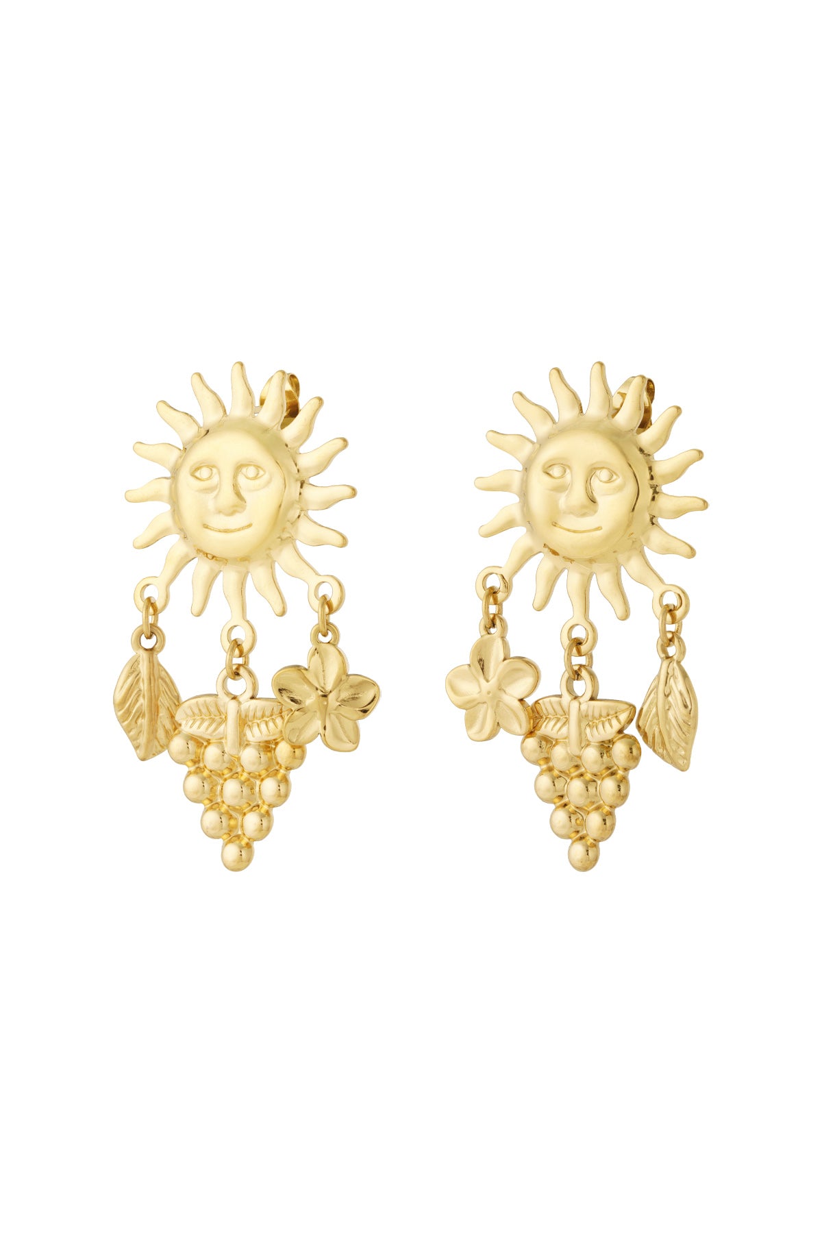 Pair of gold drop earrings with a smiling sun motif and dangling charms including a leaf, grape cluster, and flower on white background