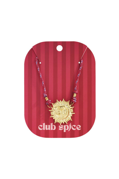 Golden Sun Drip necklace featuring a gold sun face pendant on a multicolored red cord, displayed on a striped card.