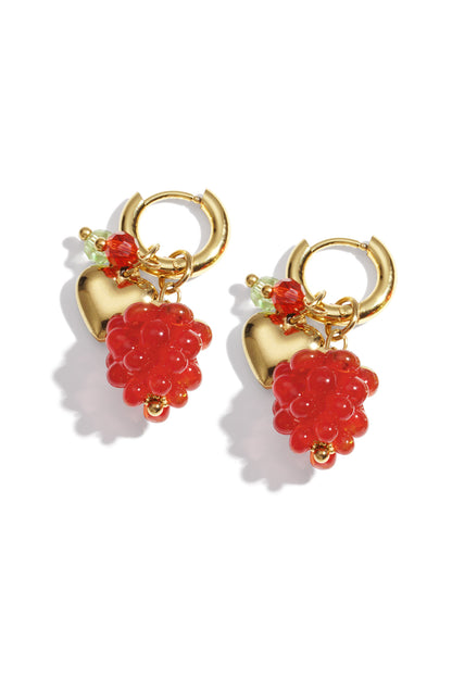 Pair of gold-tone hoop earrings featuring red grape cluster glass beads, a gold heart charm, and small colorful crystal accents on white background