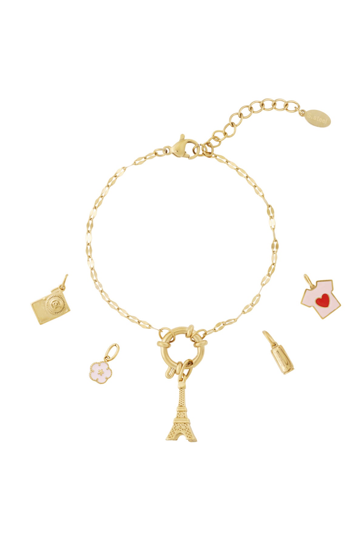 Gold chain bracelet with Eiffel Tower, pink flower, camera, beverage bottle, and pink shirt heart charms laid out flat with extra charms nearby