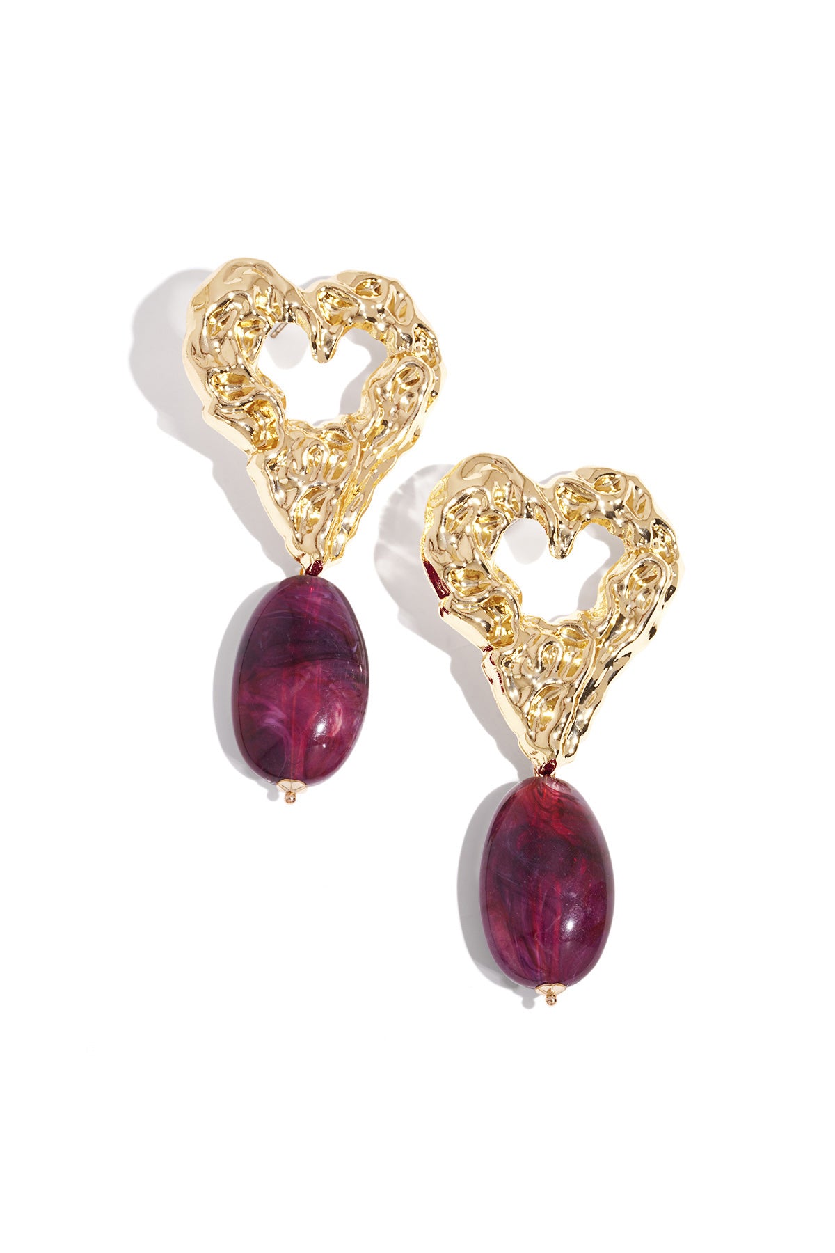 Pair of gold-tone textured heart earrings with vibrant purple marbled resin drop pendants on white background