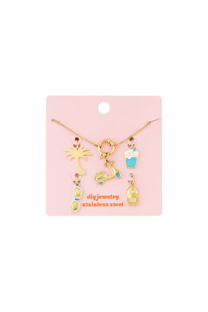 Sculpted Gold Charm Set II: Gold stainless steel necklace with summer-themed charms on a pink display card.