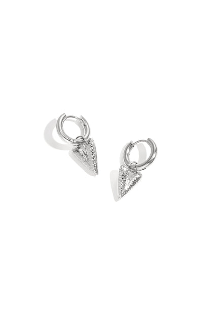 Pair of silver hoop earrings with textured heart-shaped pendants displayed on white background