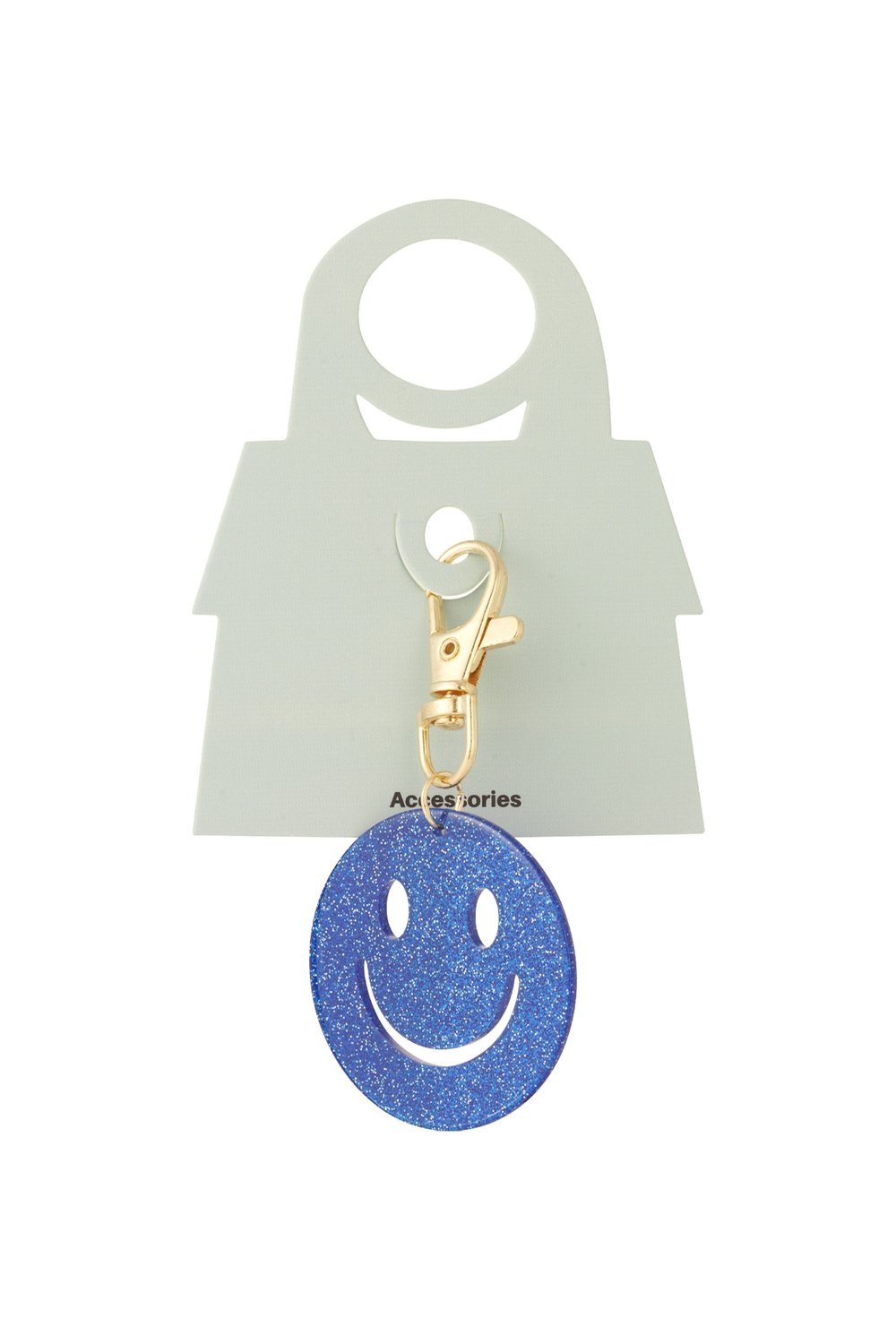 Blue glitter smiley face keychain with gold-tone lobster clasp on a branded light green display card.