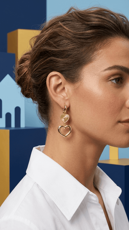 Golden Heartcore Dangles: Gold hoop earrings featuring a textured small heart charm and a larger open heart drop.