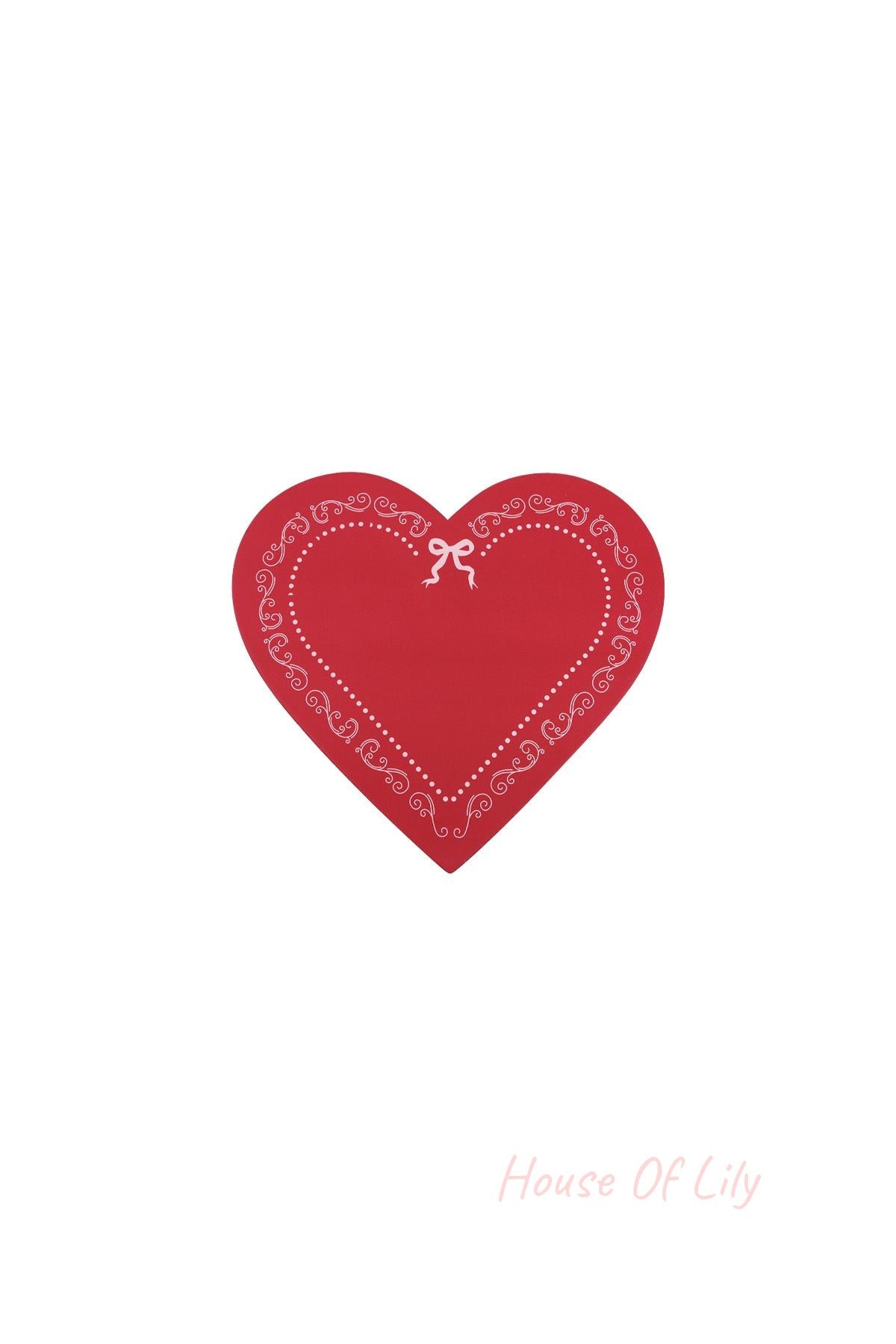 Red heart-shaped box lid decorated with white swirls and bow pattern