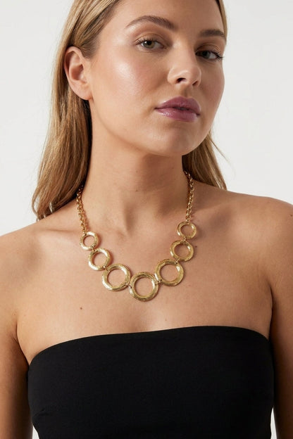 Gilded Chain Statement Necklace with textured interlocking gold hoops suspended from a link chain.