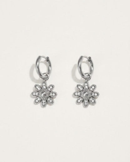 Silver flower drop earrings with small hoop tops and pavé-set crystal petals around a central metal dome.